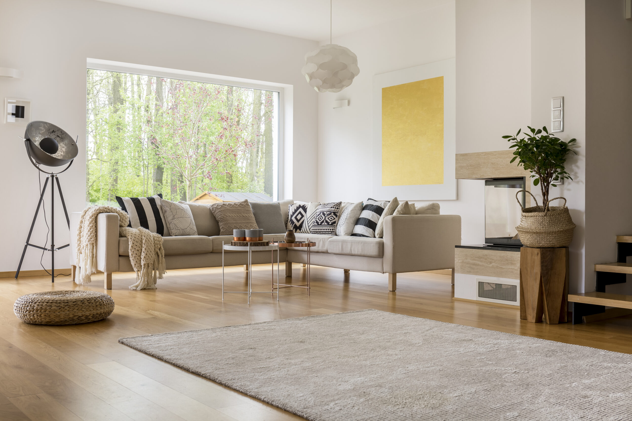 Open space in modern decorated apartment with white sofa